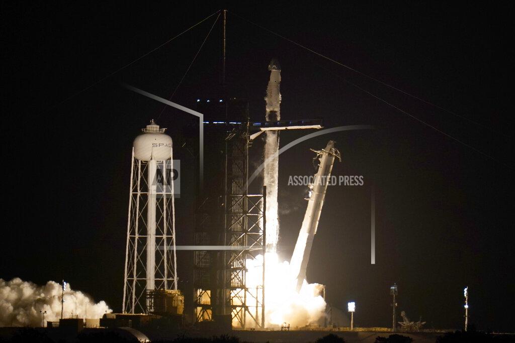 John Raoux A SpaceX Falcon 9 rocket with the Crew Dragon space capsule lifts off from pad 39A at the Kennedy Space Center in Cape Canaveral, Fla., Friday, April 23, 2021. (AP Photo/John Raoux)