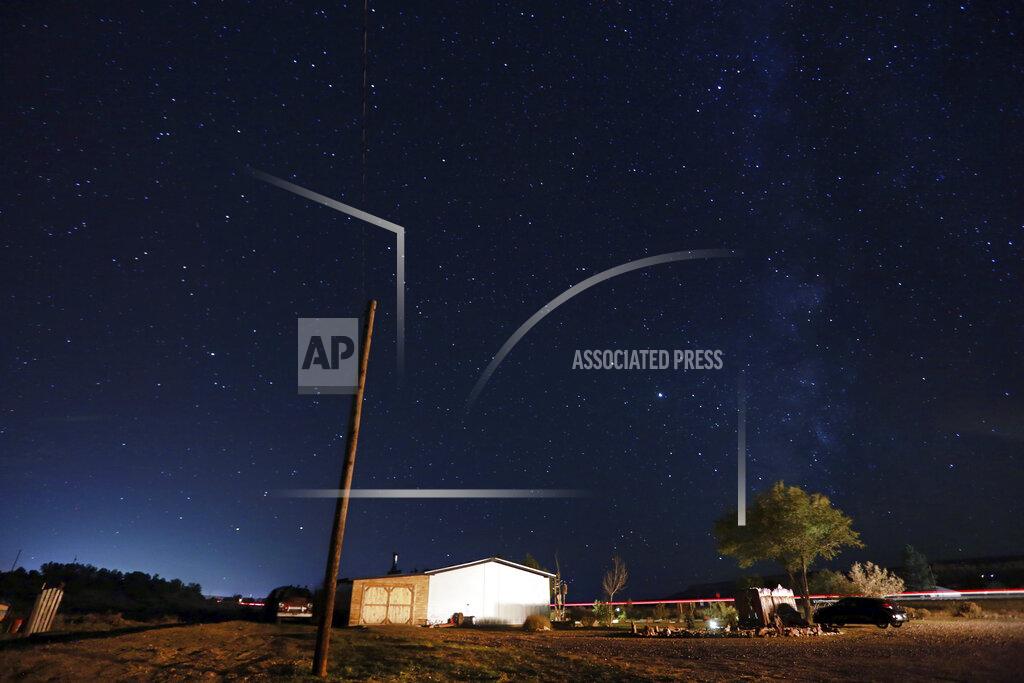 Cedar Attanasio Stars fill the night sky in rural Cuba, N.M., Oct. 18 2020. The switch to remote learning in rural New Mexico has left some students profoundly isolated — cut off from others and the grid by sheer distance. The school system is sending school buses to students’ far-flung homes to bring them assignments, meals and a little human contact. (AP Photo/Cedar Attanasio)