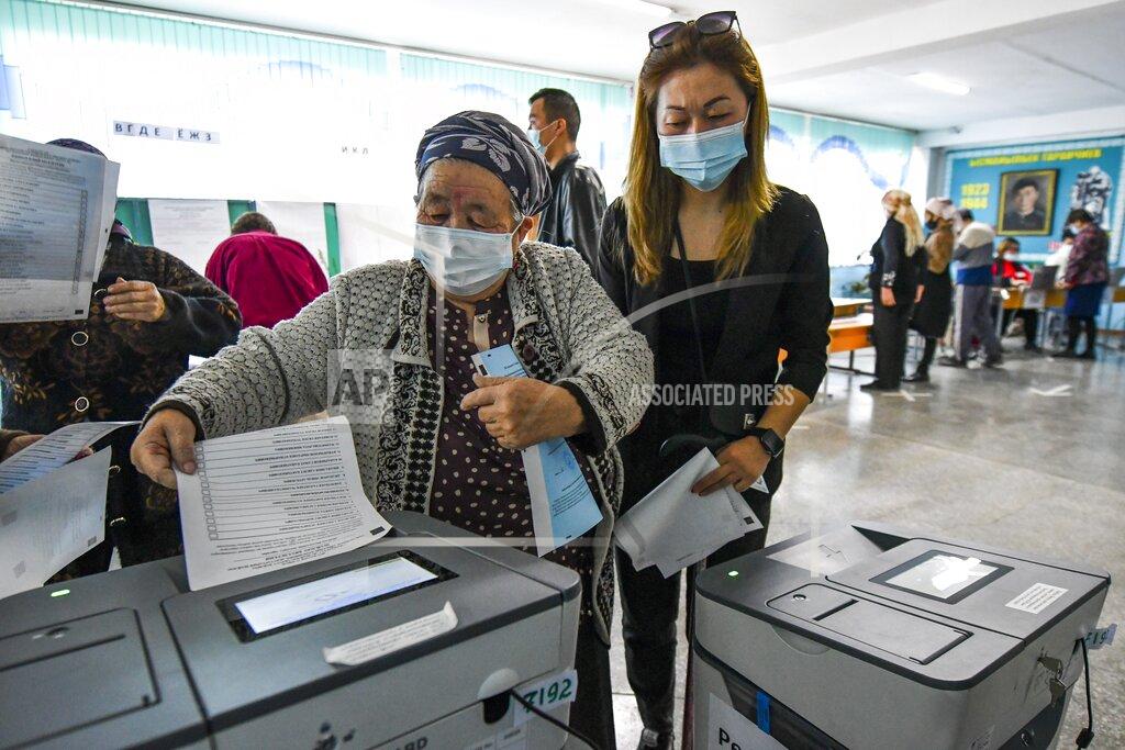 Vladimir Voronin A woman casts her ballot at a polling station during the referendum in Bishkek, Kyrgyzstan, Sunday, April 11, 2021. Voters in Kyrgyzstan cast ballots Sunday on whether to approve a new constitution that would substantially increase the president's powers. The Sunday referendum comes three months after Sadyr Zhaparov was elected president, following the ouster of the previous president amid protests, the third time in 15 years that a leader of the Central Asian country had been driven from office in a popular uprising. (AP Photo/Vladimir Voronin)