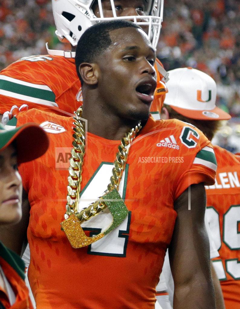Lynne Sladky FILE - In this Nov. 11, 2017, file photo, Miami defensive back Jaquan Johnson (4) wears the turnover chain after making an interception during the first half of an NCAA college football game against Notre Dame, in Miami Gardens, Fla. College football sidelines across the country are featuring everything from wrestling-style robes to boxing gloves as teams conjure up creative ways to reward big plays. It’s not a new phenomenon but schools are jumping into the arena, trying to mimic the success Miami had last season with its turnover chain.
(AP Photo/Lynne Sladky, File)