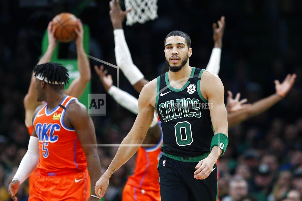 Michael Dwyer FILE - In this March 8, 2020, file photom, Boston Celtics' Jayson Tatum (0) walks on the court during the second half of an NBA basketball game against the Oklahoma City Thunder in Boston. Before the pandemic forced the NBA to pause its season, the Celtics were a team eager to figure out what they could be. It also remains to be seen whether fellow All-Star Jayson Tatum will be able to play at the high level he was before the season was suspended.(AP Photo/Michael Dwyer, File)