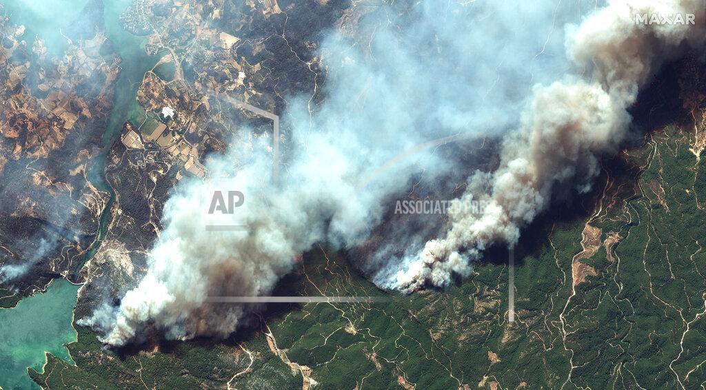 Satellite Image ©2021 Maxar Technologies In this image provided by Maxar, a satellite view of smoke rising from wildfires near Oymapinar Dam, southern Turkey, on Thursday July 29, 2021. Turkish fire crews are continuing to fight deadly blazes in southern Turkey that have burned down homes and forced many evacuations. (Satellite image ©2021 Maxar Technologies via AP)