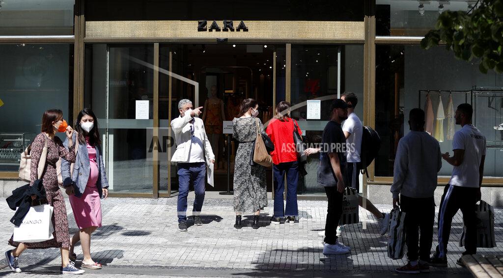 Petr David Josek People wait in line in front of a shop in Prague, Czech Republic, Monday, May 10, 2021. The Czech Republic is massively relaxing its coronavirus restrictions as the hard-hit nation pay respect to nearly 30,000 dead. Monday's wave of easing came after the new infections fell to the levels unseen from August when the government failed to react in time to an opposite trend, the growing numbers of infected which later contributed to record numbers of deaths. (AP Photo/Petr David Josek)