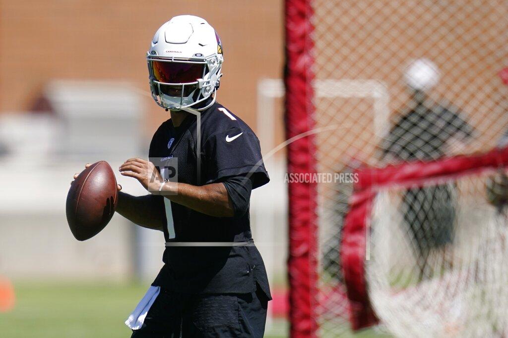 Ross D. Franklin Arizona Cardinals quarterback Kyler Murray drops back to pass as he takes part in drills at the NFL football team's practice facility Tuesday, June 14, 2022, in Tempe, Ariz. (AP Photo/Ross D. Franklin)