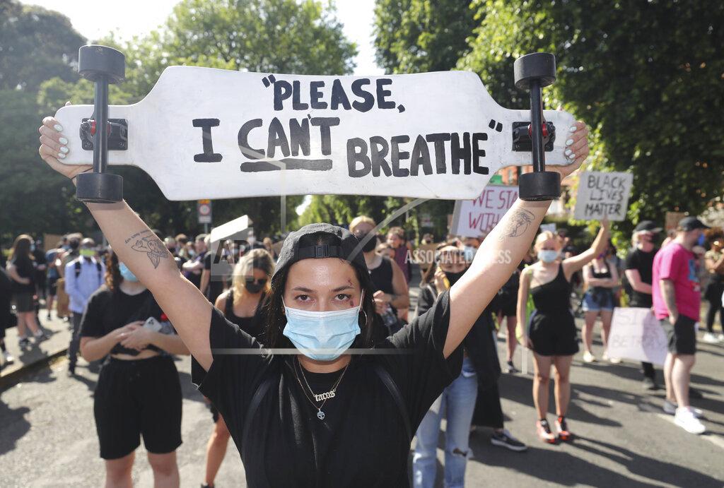 Niall Carson People protest under the slogan Black Lives Matter, and I Can't Breathe, rally outside the US Embassy in Dublin, Ireland, Monday June 1, 2020, following the death of George Floyd. The recent killing of George Floyd in Minneapolis, USA, has led to protests in many countries, and across the U.S. (Niall Carson/PA via AP)