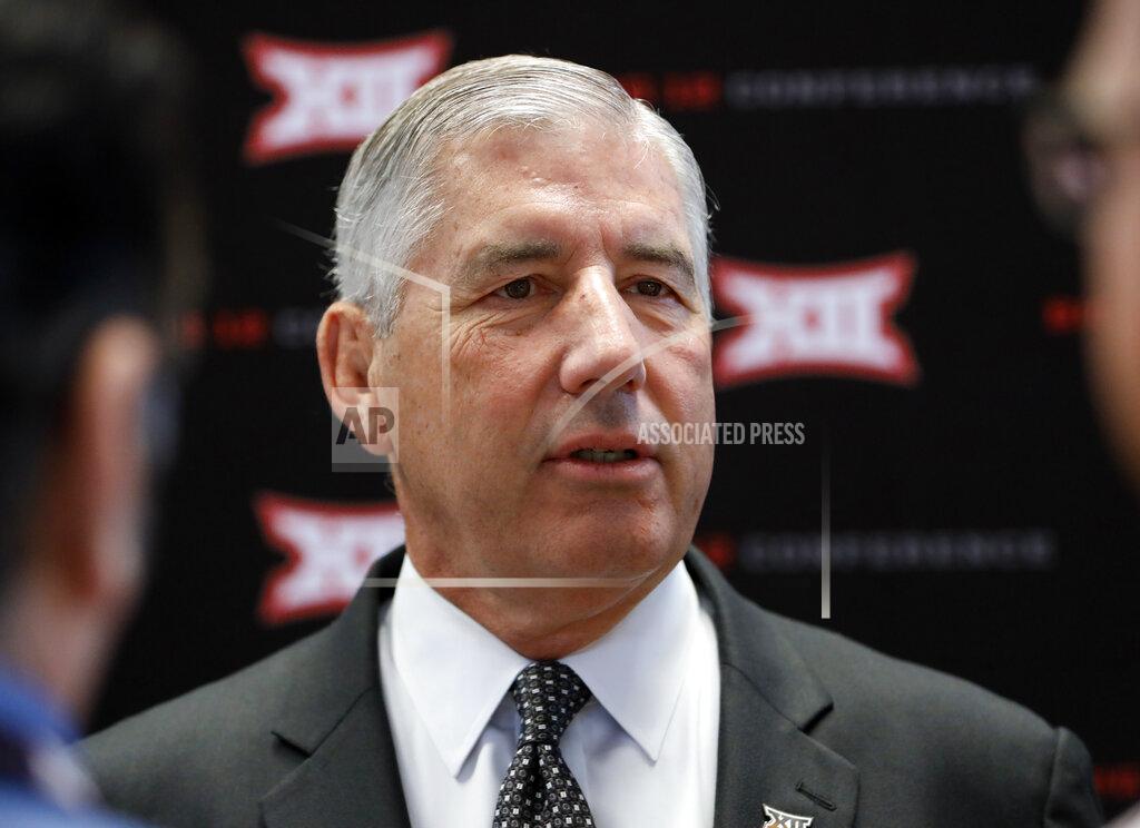 David Kent FILE - In this July 15, 2019, file photo, conference commissioner Bob Bowlsby answers questions from reporters after his opening remarks on the first day of Big 12 Conference NCAA college football media days, at AT&T Stadium in Arlington, Texas. Parity in the Big 12 this season makes for good competition but also presents a quandary about the league’s chances of qualifying a team for the College Football Playoff. Bowlsby says parity “makes it more difficult, there isn’t any question about that.”(AP Photo/David Kent, File)