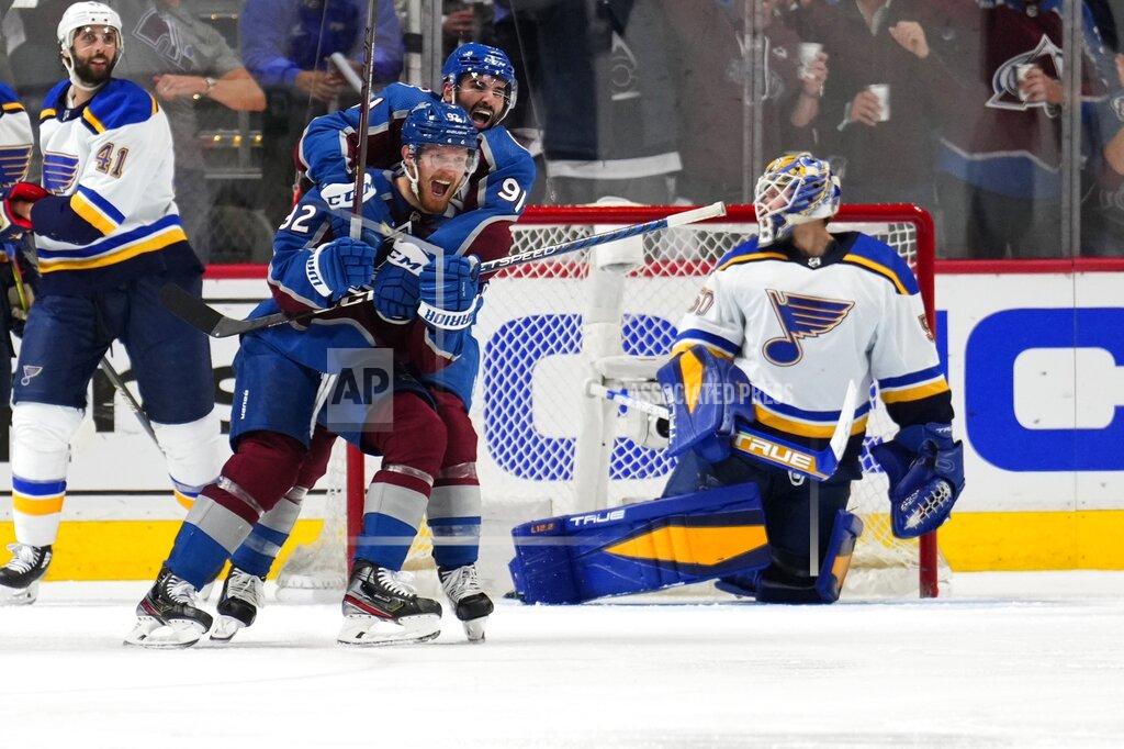 Jack Dempsey Colorado Avalanche left wing Gabriel Landeskog (92) celebrates a goal against the St. Louis Blues with Nazem Kadri (91) during the third period in Game 2 of an NHL hockey Stanley Cup second-round playoff series Thursday, May 19, 2022, in Denver. (AP Photo/Jack Dempsey)