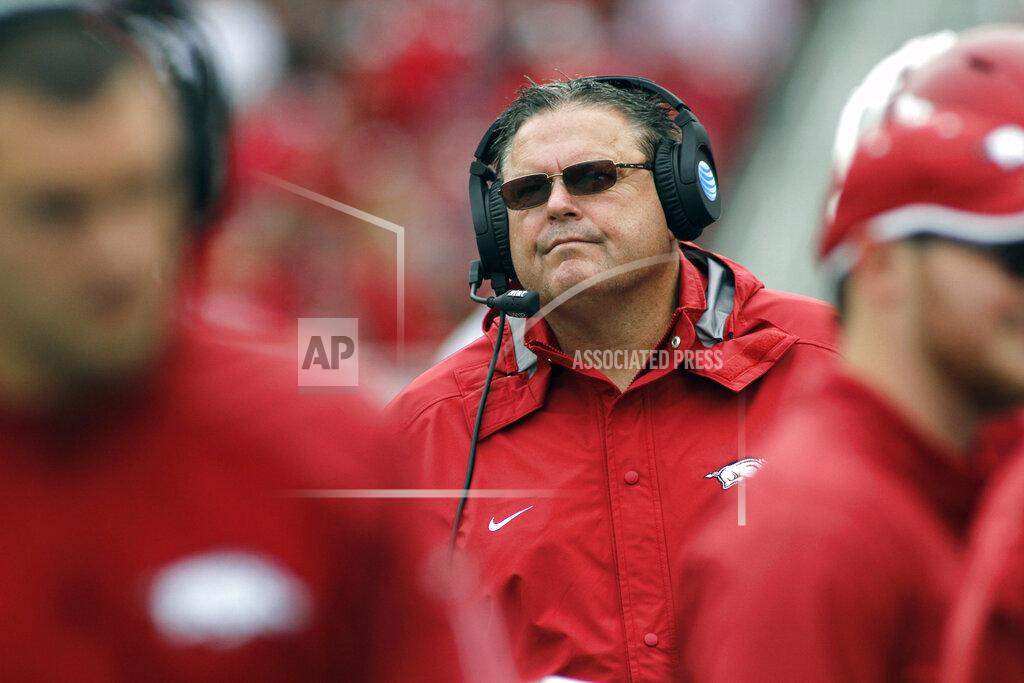 Samantha Baker FILE - In this Saturday, Oct. 24, 2015 file photo, Arkansas' Sam Pittman watches his players run off the field during the second half of an NCAA college football game against Auburn in Fayetteville, Ark. Just when it seemed like things were up and rolling, the COVID-19 pandemic hit. The national shutdown hurt coaches across college football as they prepare for the 2020-21 season, but it was particularly difficult on programs with first-year coaches trying to build something new from the ground up. (AP Photo/Samantha Baker, File)