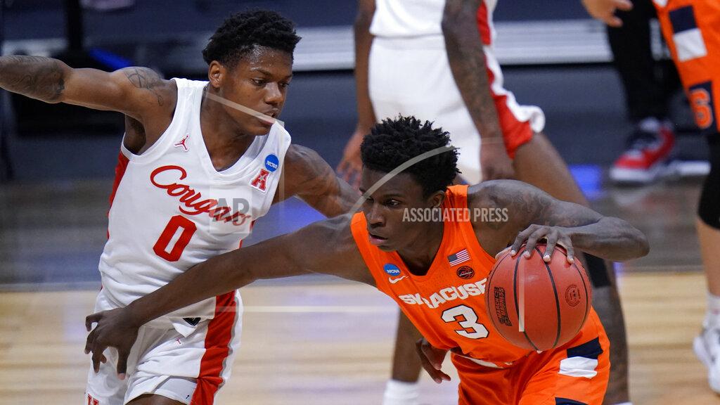 Aj Mast Syracuse forward Kadary Richmond (3) drives on Houston guard Marcus Sasser (0) in the first half of a Sweet 16 game in the NCAA men's college basketball tournament at Hinkle Fieldhouse in Indianapolis, Saturday, March 27, 2021. (AP Photo/AJ Mast)