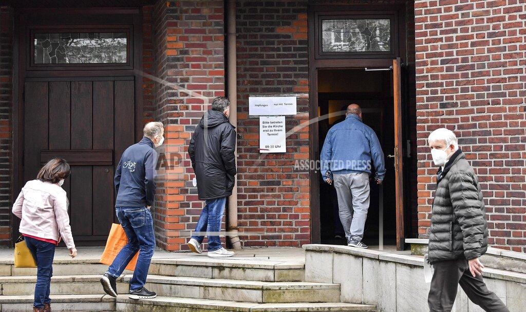 Martin Meissner People enter the St. Antonius church in the city of Castrop-Rauxel, Germany, to get the AstraZeneca vaccination against the coronavirus on Wednesday, May 19, 2021. Family doctors of the city asked to use the spacious church instead of their limited offices to get hundreds of patients vaccinated. (AP Photo/Martin Meissner)