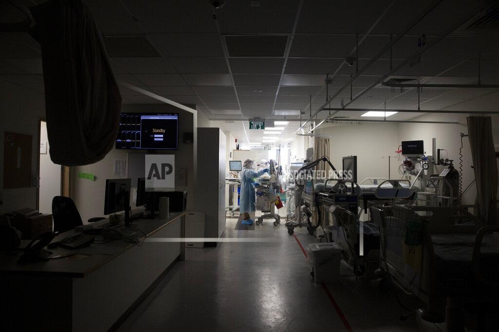Maya Alleruzzo FILE - In this Aug. 31, 2021, file, photo, a darkened corridor of empty beds is prepared for patients on the coronavirus ward at Shaare Zedek Medical Center in Jerusalem. Israeli health officials say the booster shot, which has already been delivered to about a third of the population, is helping to suppress the country’s latest wave of COVID-19 infections. (AP Photo/Maya Alleruzzo, File)