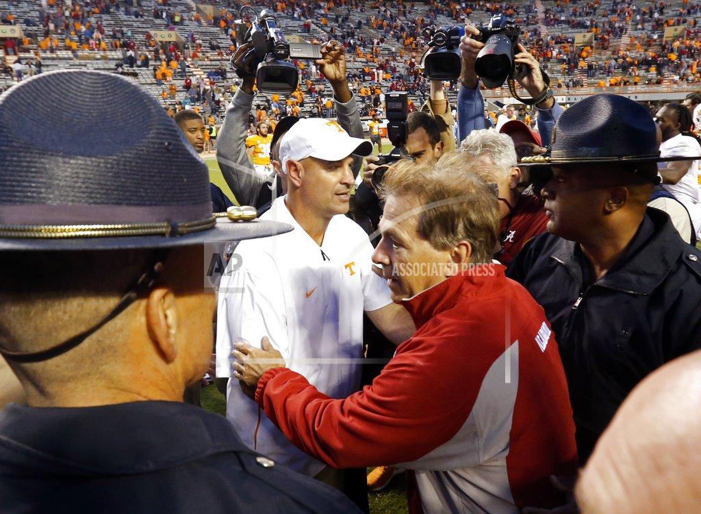 Wade Payne Tennessee head coach Jeremy Pruitt, left, and Alabama head coach Nick Saban meet on the field after an NCAA college football game Saturday, Oct. 20, 2018, in Knoxville, Tenn. Alabama won 58-21. (AP Photo/Wade Payne)
