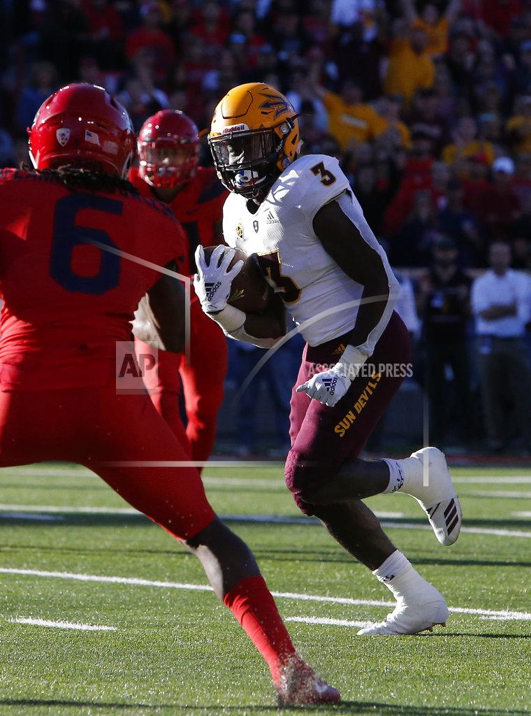 Rick Scuteri Arizona State running back Eno Benjamin (3) scores a touchdown in front of Arizona safety Demetrius Flannigan-Fowles in the second half during an NCAA college football game, Saturday, Nov. 24, 2018, in Tucson, Ariz. (AP Photo/Rick Scuteri)
