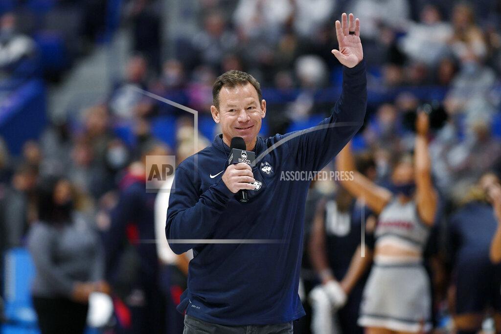 Jessica Hill New Connecticut football head coach Jim Mora is introduced at an NCAA college basketball game between Connecticut and Arkansas, Sunday, Nov. 14, 2021, in Hartford, Conn. (AP Photo/Jessica Hill)
