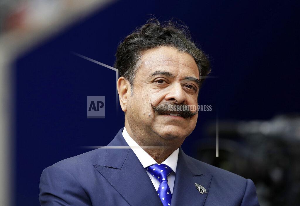 Matt Dunham In this Sept. 24, 2017 file photo, Jacksonville Jaguars owner Shahid Khan stands before an NFL football game against between the Jaguars and the Baltimore Ravens at Wembley Stadium in London. Khan announced Wednesday, Oct. 2, 2019, that he is a majority investor in the nation's only 24-hour news network aimed at African American viewers. The network is to begin broadcasting in November and will be based in Tallahassee, Florida's capital, with bureaus around the country. (AP Photo/Matt Dunham, File)