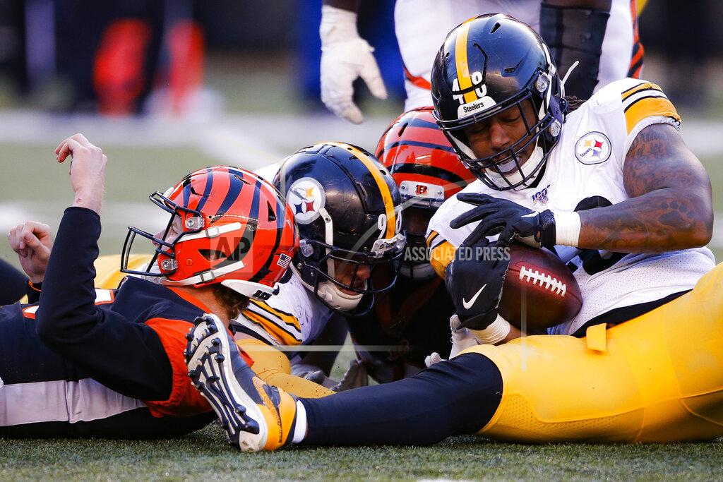 Gary Landers Pittsburgh Steelers outside linebacker Bud Dupree (48) recovers a fumble he forced on Cincinnati Bengals quarterback Ryan Finley, left, for a turnover during the second half an NFL football game, Sunday, Nov. 24, 2019, in Cincinnati. (AP Photo/Gary Landers)