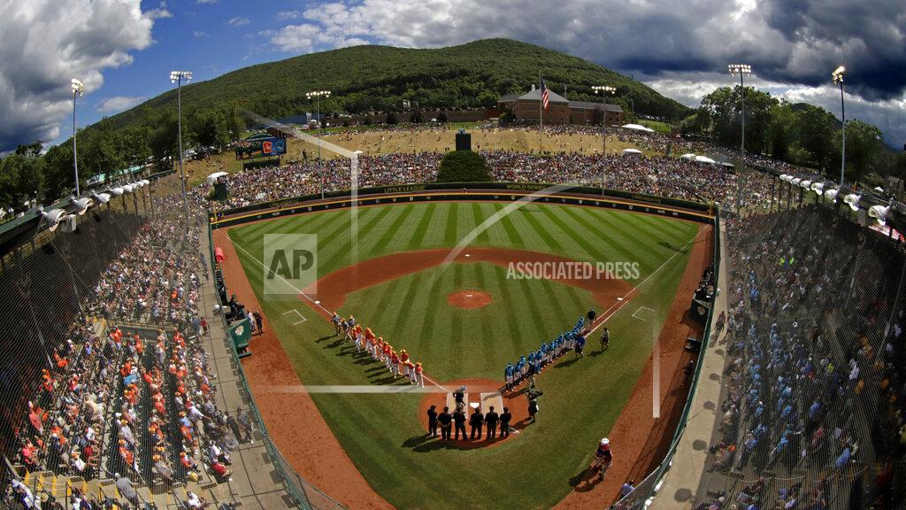 Gene J. Puskar FILE - In this Sunday, Aug. 25, 2019, file photo, River Ridge, Louisiana, lines the third baseline and Curacao lines the first baseline during team introductions before the Little League World Series Championship game at Lamade Stadium in South Williamsport, Pa. The 2020 Little League World Series and the championship tournaments in six other Little League divisions have been canceled because of the new coronavirus pandemic. (AP Photo/Gene J. Puskar, File)