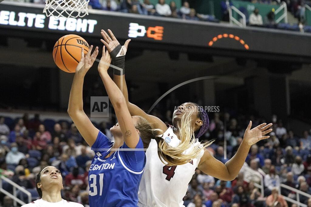Gerry Broome South Carolina forward Aliyah Boston (4) blocks Creighton forward Emma Ronsiek (31) during the first half of a college basketball game in the Elite 8 round of the NCAA tournament in Greensboro, N.C., Sunday, March 27, 2022. (AP Photo/Gerry Broome)