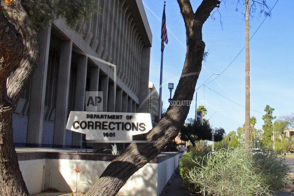 FILE - In this March 16, 2016, file photo, is the Arizona Department of Corrections, Rehabilitation and Reentry headquarters in Phoenix. Prison officials will start offering COVID-19 vaccinations on Friday, Jan. 15, 2021, to corrections officers at the Perryville prison in Goodyear, with other prisons to follow in the future. State corrections officers can get vaccinated through either the corrections department or through counties where they work, some of which are already making vaccines available to them. (AP Photo/Bob Christie, File)
