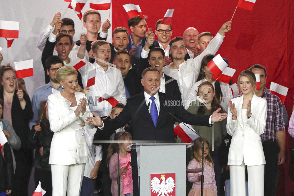 Czarek Sokolowski Incumbent President Andrzej Duda, center, gestures next to his wife Agata Kornhauser-Duda and daughter Kinga, right while speaking to supporters in Pultusk, Poland, Sunday, July 12, 2020. Conservative Duda ran against liberal Warsaw Mayor Rafal Trzaskowski in a razor-blade-close presidential election runoff and exit poll shows election is too close to call. (AP Photo/Czarek Sokolowski)
