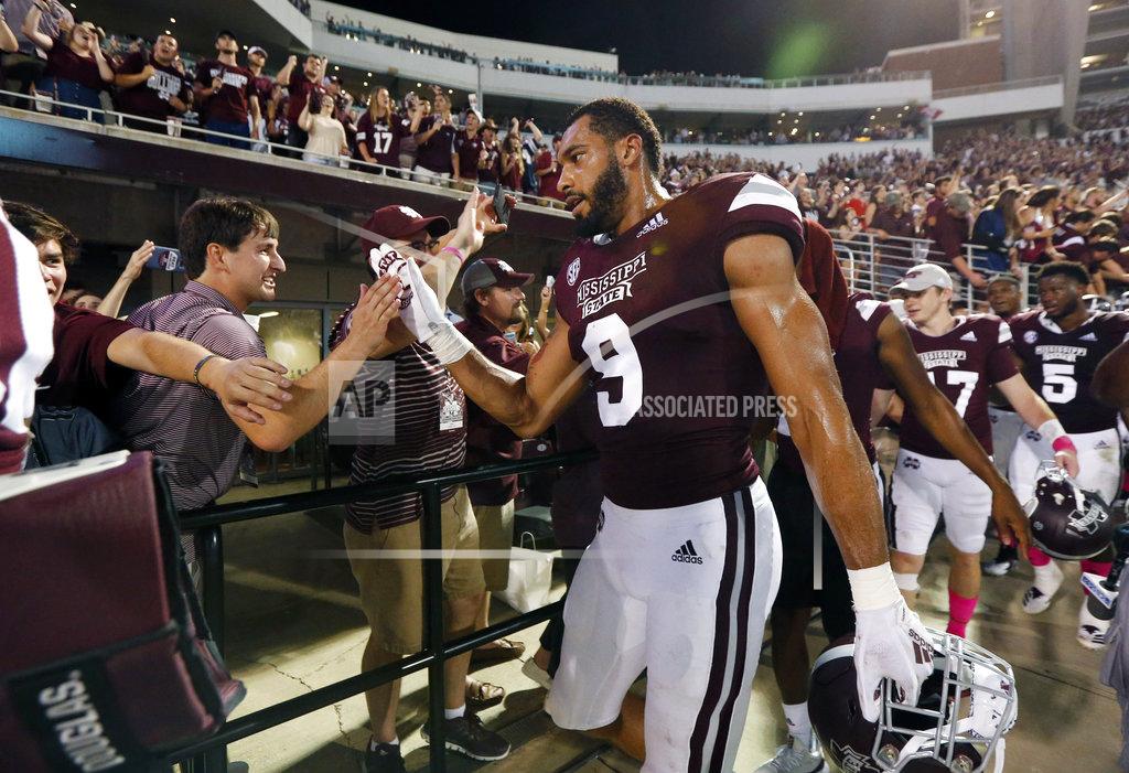 Rogelio V. Solis Mississippi State defensive end Montez Sweat (9) celebrates with fans following the team's NCAA college football game against Auburn in Starkville, Miss., Saturday, Oct. 6 2018. Mississippi State won 23-9. (AP Photo/Rogelio V. Solis)