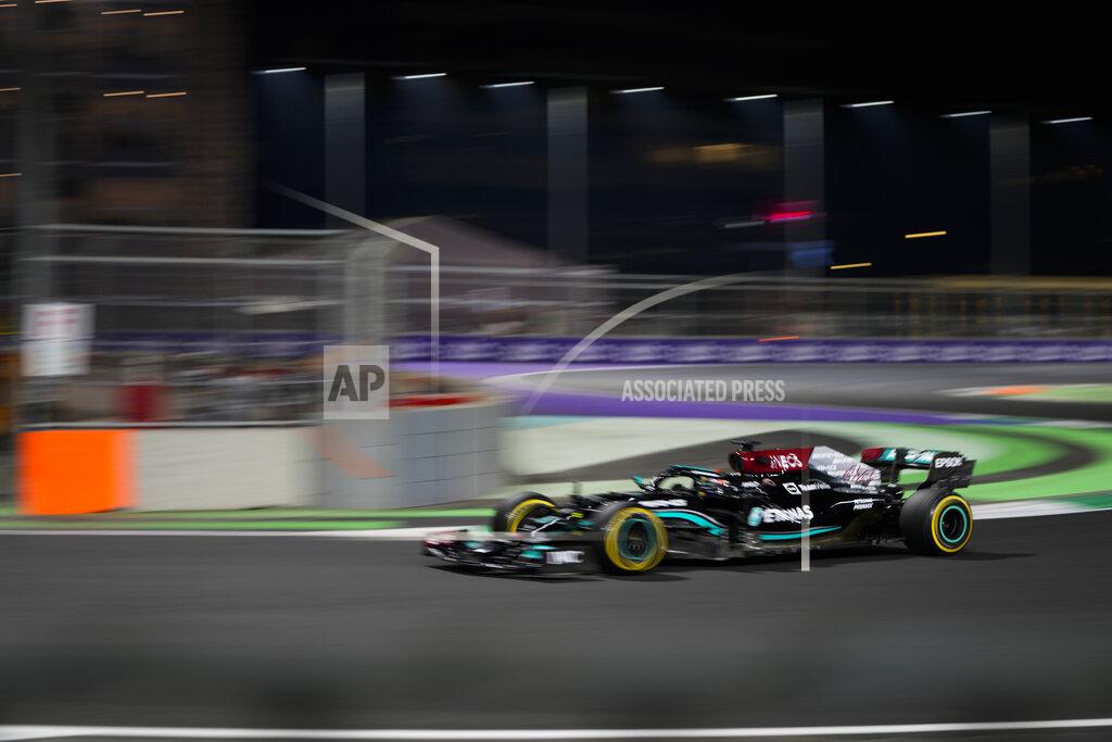 Hassan Ammar Mercedes driver Lewis Hamilton of Britain lin action during practice session for the Saudi Arabian Grand Prix in Jiddah, Friday, Dec. 3, 2021. (AP Photo/Hassan Ammar)