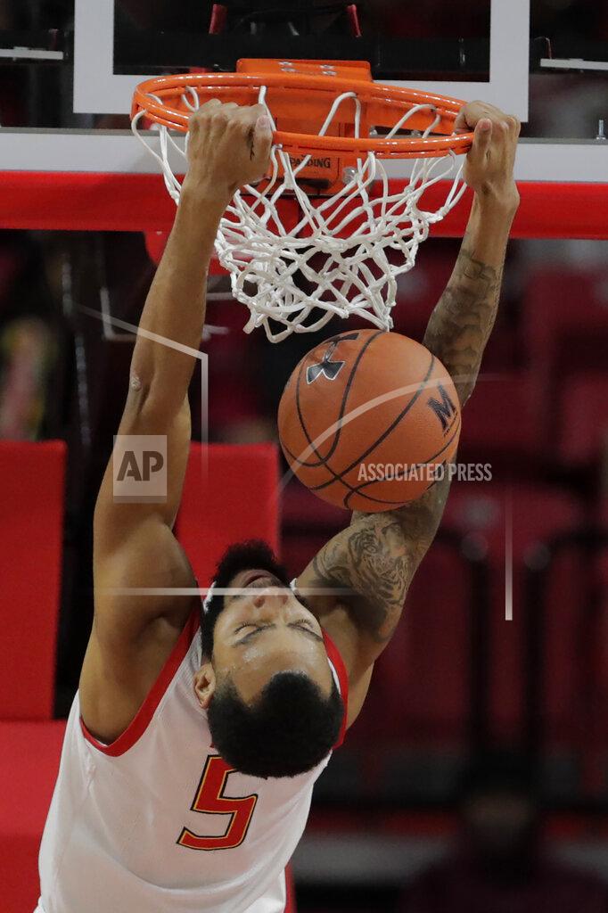 Julio Cortez Maryland guard Eric Ayala dunks on Holy Cross during the second half of an NCAA college basketball game, Tuesday, Nov. 5, 2019, in College Park, Md. Maryland won 95-71. (AP Photo/Julio Cortez)