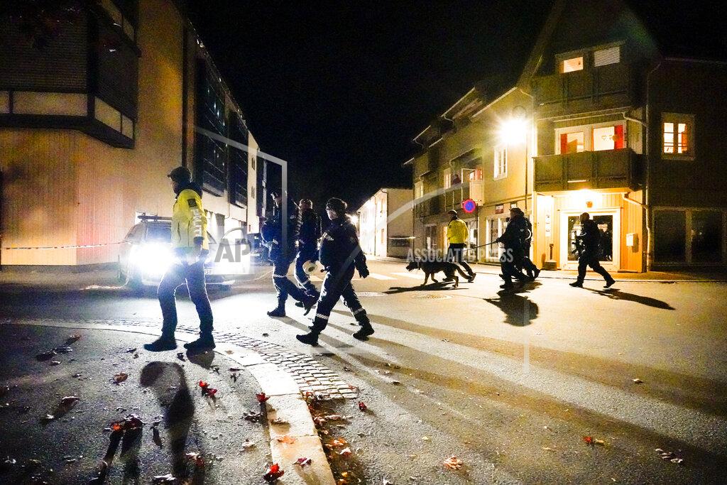 Hakon Mosvold Larsen Police walk at the scene after an attack in Kongsberg, Norway, Wednesday, Oct. 13, 2021. Several people have been killed and others injured by a man armed with a bow and arrow in a town west of the Norwegian capital, Oslo. (Hakon Mosvold Larsen/NTB Scanpix via AP)