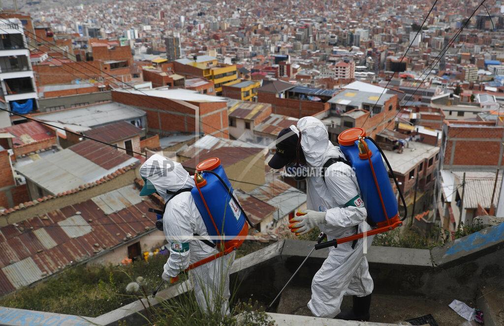 Juan Karita FILE - In this April 28, 2020, file photo, city workers disinfect a stairway in attempt to help contain the spread of the new coronavirus, in La Paz, Bolivia. Even amid a global pandemic, there’s no sign that corruption is slowing down in Latin America. Perhaps the biggest case is in Bolivia, where the health minister was arrested amid allegations that officials bought 170 ventilators at inflated prices. (AP Photo/Juan Karita, File)