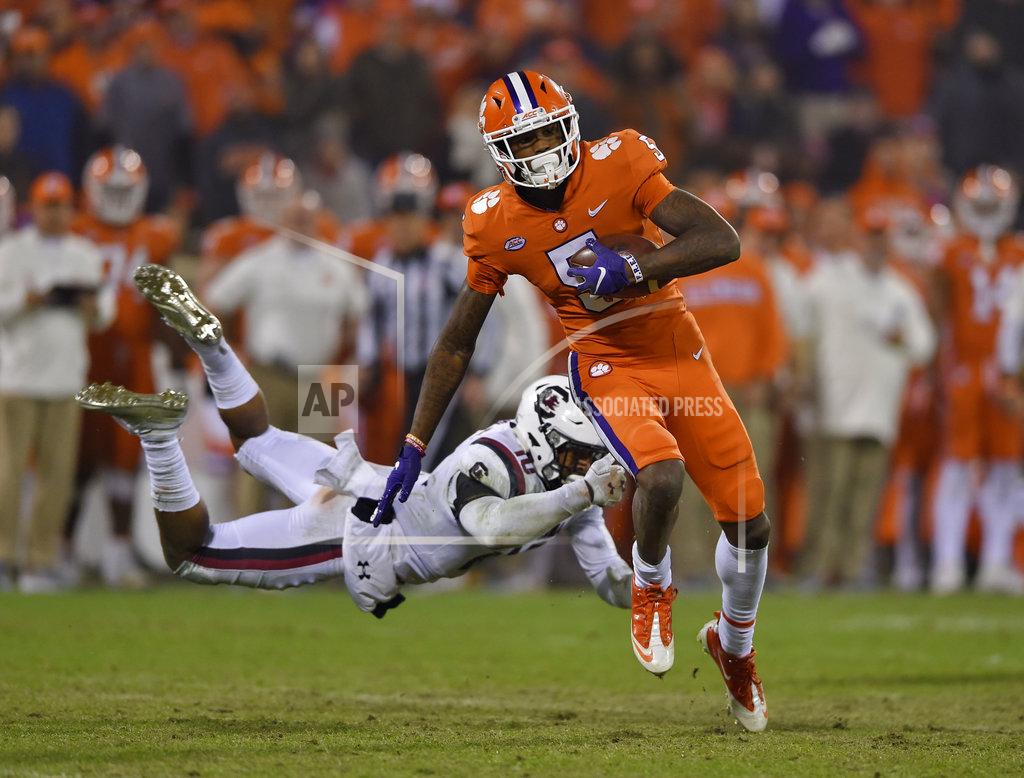 Richard Shiro Clemson's Tee Higgins (5) outruns the tackle attempt by South Carolina's R.J. Roderick during the second half of an NCAA college football game Saturday, Nov. 24, 2018, in Clemson, S.C. (AP Photo/Richard Shiro)
