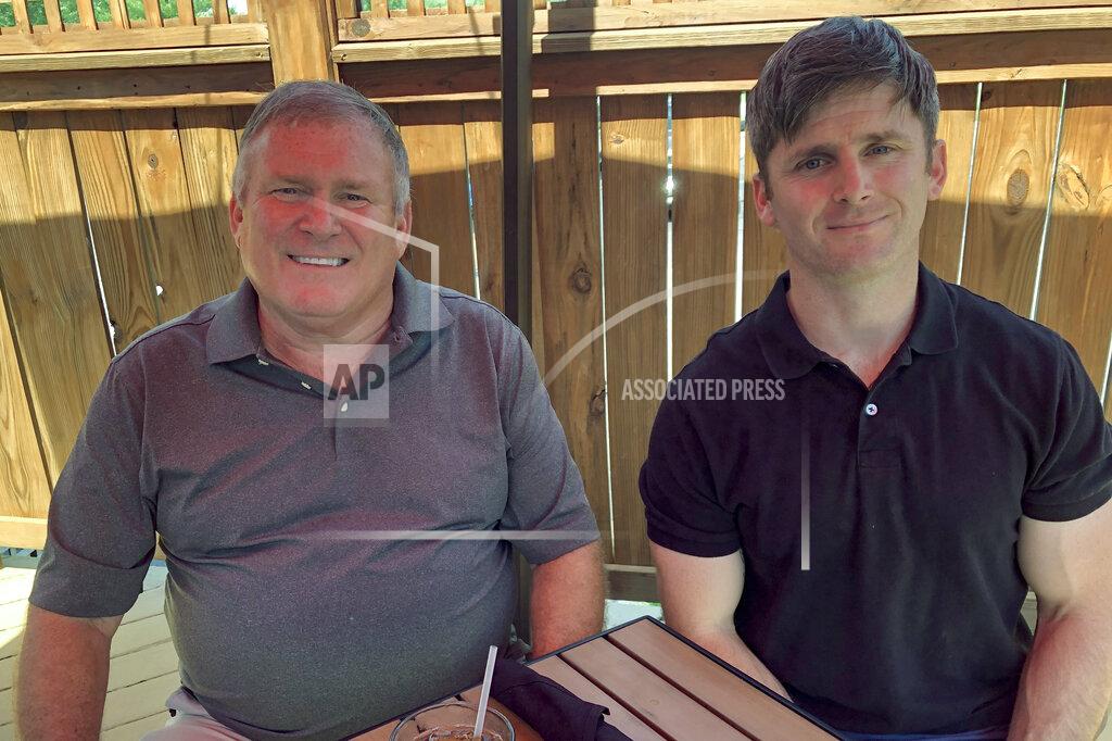 Dan Sewell This photo from June 26, 2020 shows Buck Newsome, left, a Baby Boomer, and his son, Chris Newsome, of the Millennial generation, as they pose for a photo while having lunch together in Newtown, Ohio. American's two largest generations can agree on something: the coronavirus pandemic has hit them both hard. For Baby Boomers, named for the post-World War II surge of births, that means those who retired or are nearing retirement age are seeing their retirement accounts in a free fall. Millennials, usually defined as those born between 1981 and 1996, who became adults in this century, are getting socked as they were trying to begin careers or moving into peak earning years after many walked off college campuses into the Great Recession. (AP Photo/Dan Sewell)