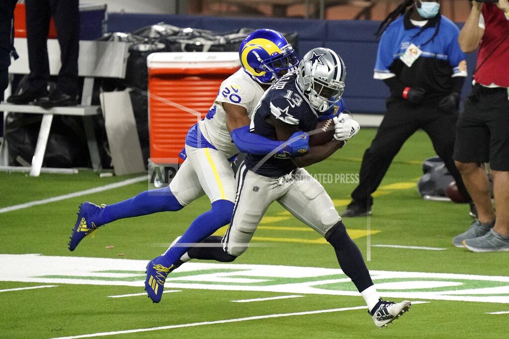 Jae C. Hong Dallas Cowboys wide receiver Michael Gallup (13) makes a catch but is called for offensive pass interference on Los Angeles Rams cornerback Jalen Ramsey, left, during the second half of an NFL football game Sunday, Sept. 13, 2020, in Inglewood, Calif. (AP Photo/Jae C. Hong)