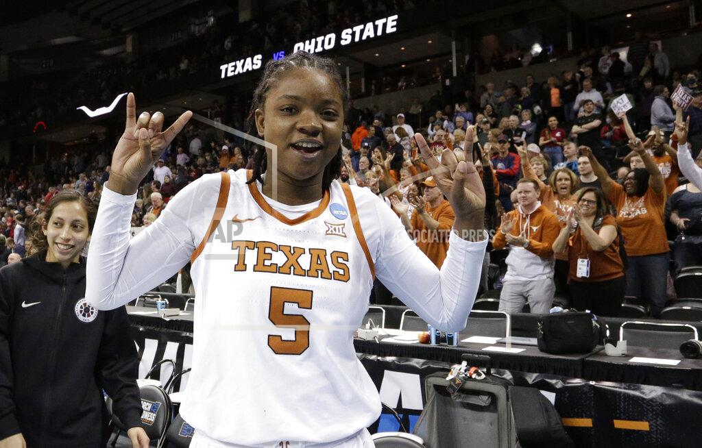 Young Kwak Texas forward DeYona Gaston (5) reacts after a college basketball game against Ohio State in the Sweet 16 round of the NCAA tournament, Friday, March 25, 2022, in Spokane, Wash. Texas won 66-63. (AP Photo/Young Kwak)
