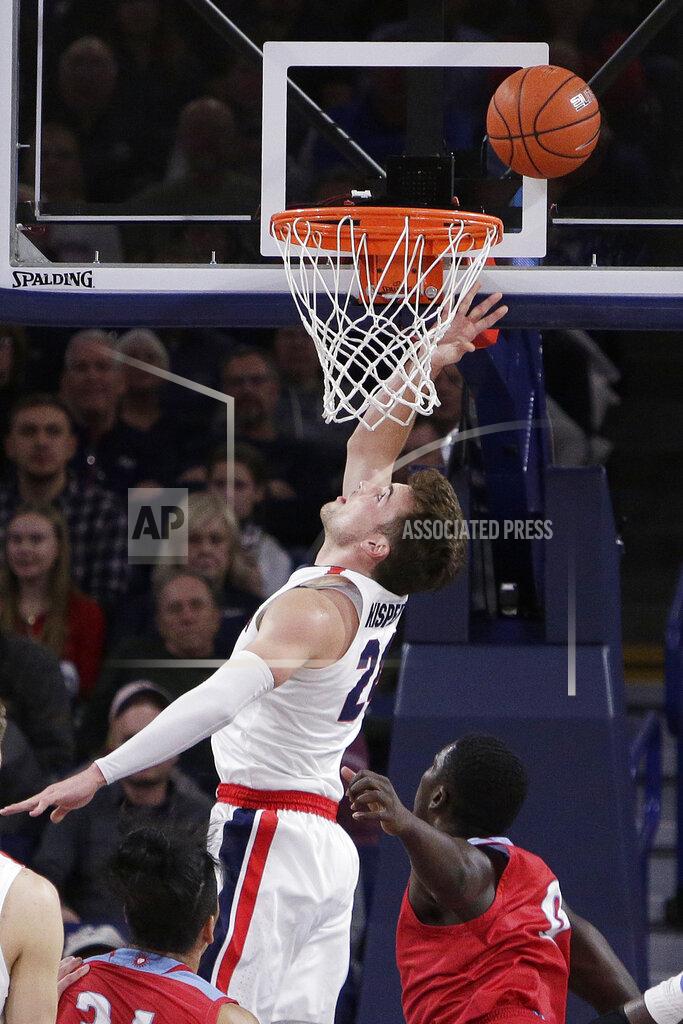 Young Kwak Gonzaga forward Corey Kispert, top, shoots in front of Loyola Marymount guard Eli Scott during the first half of an NCAA college basketball game in Spokane, Wash., Thursday, Feb. 6, 2020. (AP Photo/Young Kwak)