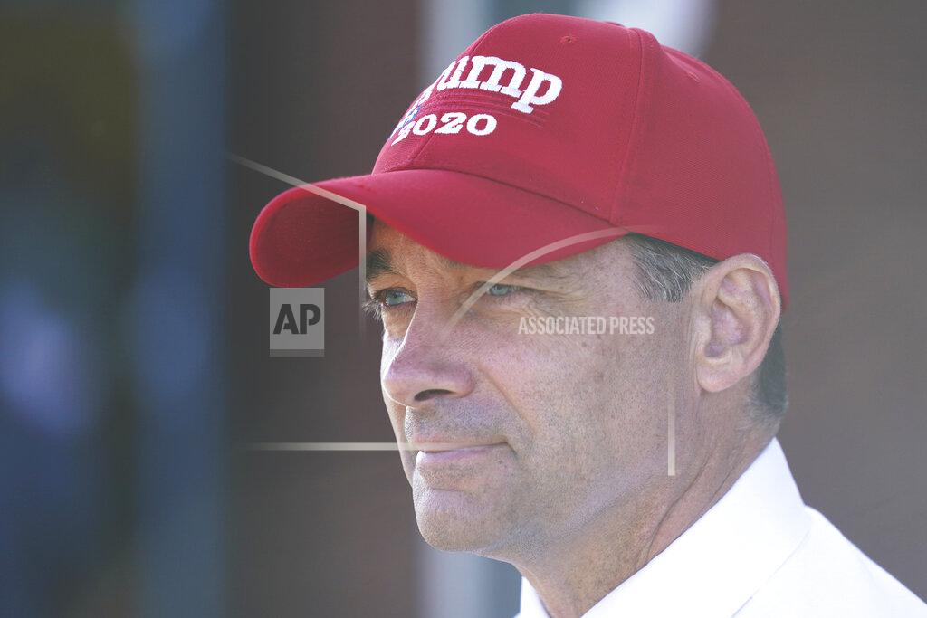 Steve Helber Republican Congressional candidate Bob Good waits for voters at a polling place in Charlottesville, Va., Tuesday Nov. 3, 2020. Good is facing Democrat Cameron Webb in today's election. (AP Photo/Steve Helber)