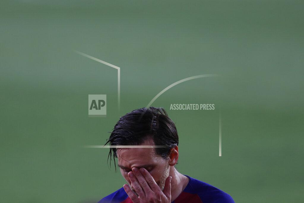 Angel Fernandez Barcelona's Lionel Messi gestures during the Spanish La Liga soccer match between Sevilla and FC Barcelona at the Ramon Sanchez-Pizjuan stadium in Seville, Spain, Friday, June 19, 2020. (AP Photo/Angel Fernandez)