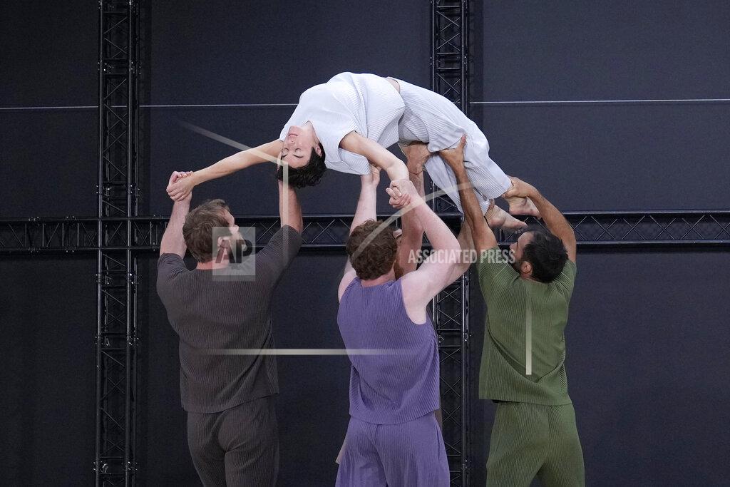 Francois Mori Models wear creations as part of Issey Miyake Homme Plisse men's Spring Summer 2023 collection presented in Paris, France, Thursday, June 23, 2022. (AP Photo/Francois Mori)