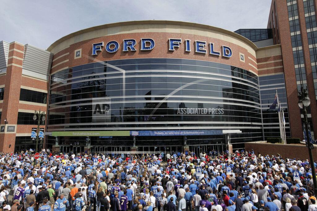 FILE - Fans arrive to Ford Field before and NFL football game between the Detroit Lions and Minnesota Vikings in Detroit, in this Sept. 20, 2009, file photo. The Detroit Lions say Ford Field can be at full capacity this season, a year after the public did not have access to games during the pandemic. The Lions announced Monday, July 12, 2021, the decision was made in large part because of Michigan's steady COVID-19 vaccination rate. (AP Photo/Paul Sancya, File)