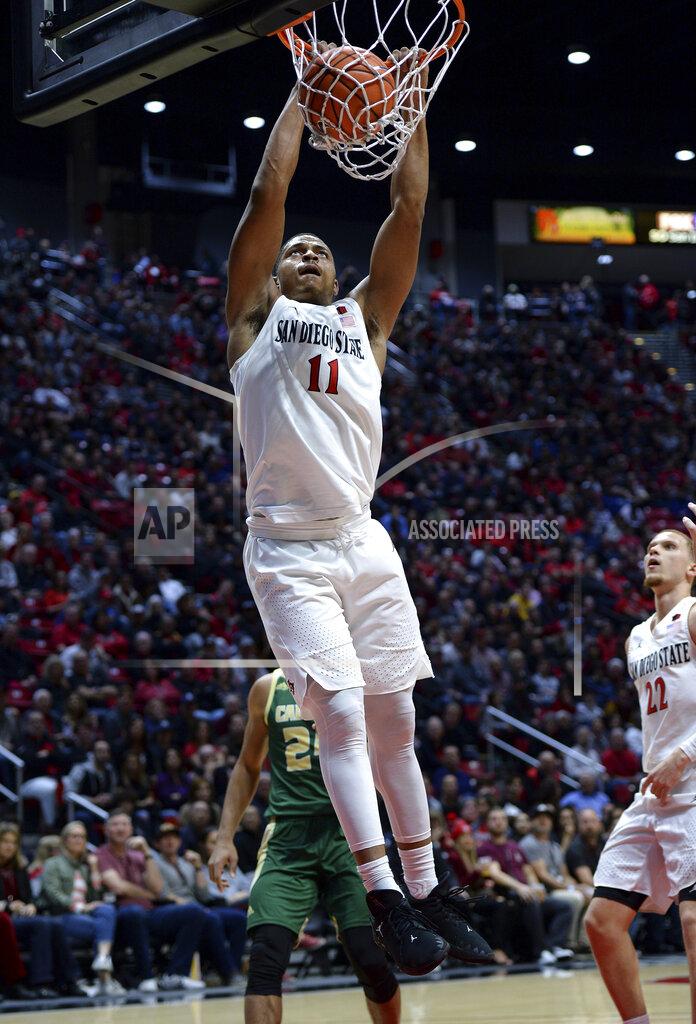 Orlando Ramirez San Diego State forward Matt Mitchell dunks during the first half of the team's NCAA college basketball game against Cal Poly on Saturday, Dec. 28, 2019, in San Diego. (AP Photo/Orlando Ramirez)