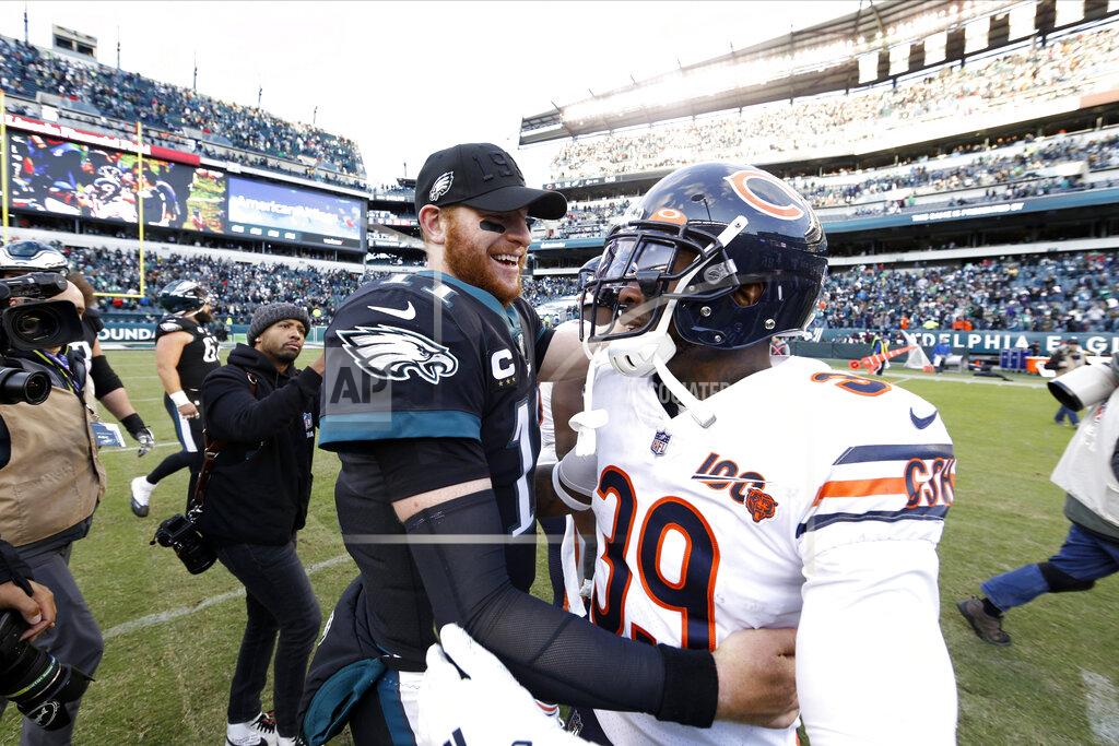 Chris Szagola Philadelphia Eagles' Carson Wentz, left, and Chicago Bears' Eddie Jackson (39) meet after an NFL football game, Sunday, Nov. 3, 2019, in Philadelphia. (AP Photo/Chris Szagola)