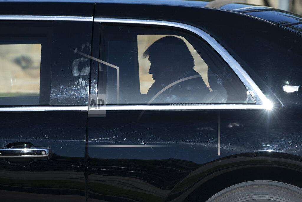 FILE - In this June 11, 2020, file photo President Donald Trump rides in his limousine as he departs after speaking during a roundtable discussion about "Transition to Greatness: Restoring, Rebuilding, and Renewing," at Gateway Church Dallas in Dallas. (AP Photo/Alex Brandon, File)
