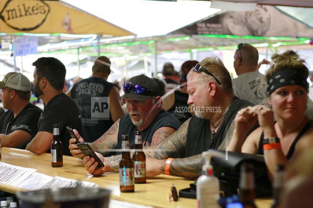 Stephen Groves FILE - In this Aug. 7, 2020 file photo, people congregate at One-Eyed Jack's Saloon during the 80th annual Sturgis Motorcycle Rally in Sturgis, S.D.. Hundreds of thousands of people attended the Sturgis Motorcycle Rally in South Dakota from Aug. 7 to 16. Minnesota health officials reported Wednesday, Sept. 2, 2020, that a man in his 60s who attended the rally died from COVID-19. (AP Photo/Stephen Groves File)