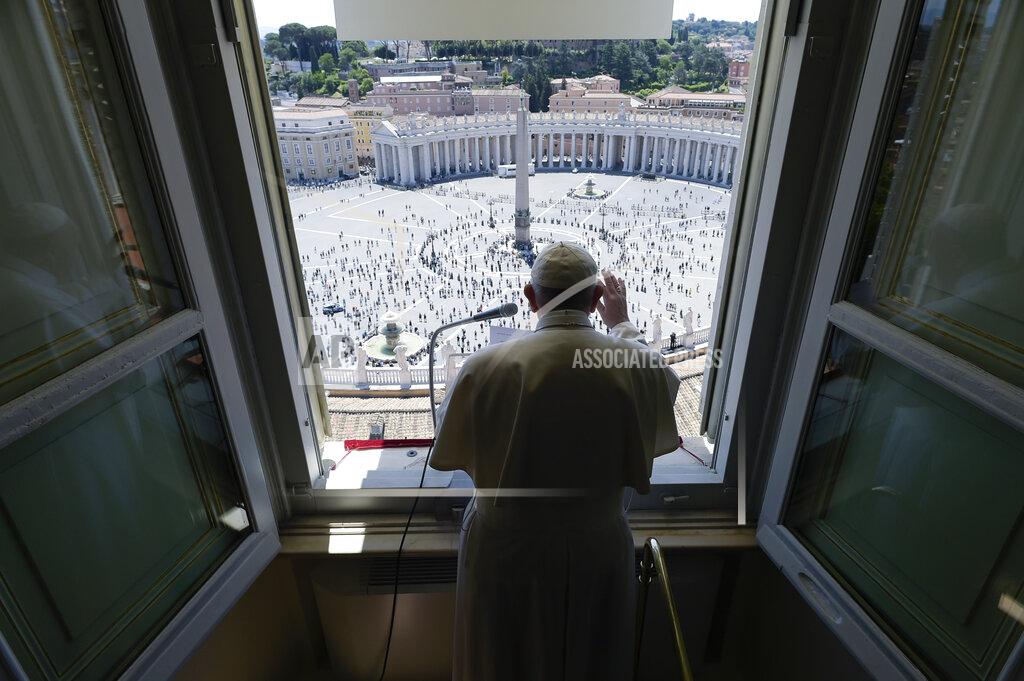 Pope Francis delivers his blessing from his studio window overlooking St. Peter's Square at the Vatican, Sunday, May 31, 2020. Francis celebrated a Pentecost Mass in St. Peter's Basilica on Sunday, albeit without members of the public in attendance. He will then went to his studio window to recite his blessing at noon to the crowds below. The Vatican says police will ensure the faithful gathered in the piazza keep an appropriate distance apart. (Vatican News via AP)