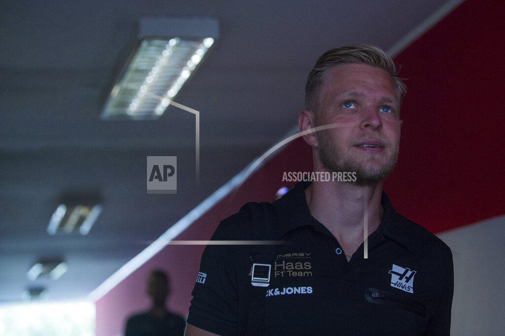 Zoltan Balogh Danish Formula One driver Kevin Magnussen of Haas F1 Team walks through the Hungaroring circuit in Mogyorod, Hungary, Thursday, Aug. 1, 2019. The Hungarian Formula One Grand Prix will take place on Aug. 4, 2019. (Zoltan Balogh/MTI via AP)