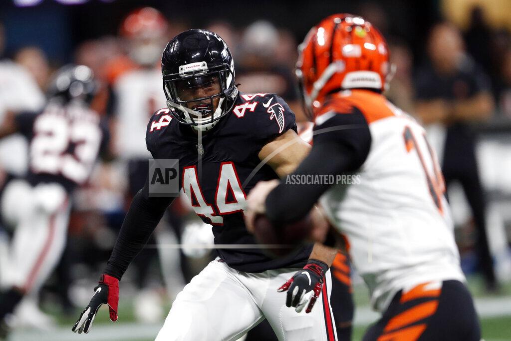 FILE - In this Sept. 30, 2018, file photo, Atlanta Falcons linebacker Vic Beasley (44) rushes against the Cincinnati Bengals during the second half of an NFL football game in Atlanta. Tennessee Titans general manager Jon Robinson says he has been in touch with Beasley and that the linebacker knows his absence from training camp is unexcused. The Titans signed him to a one-year deal for $9.5 million in March to help bulk up their pass rush. (AP Photo/John Bazemore, File)