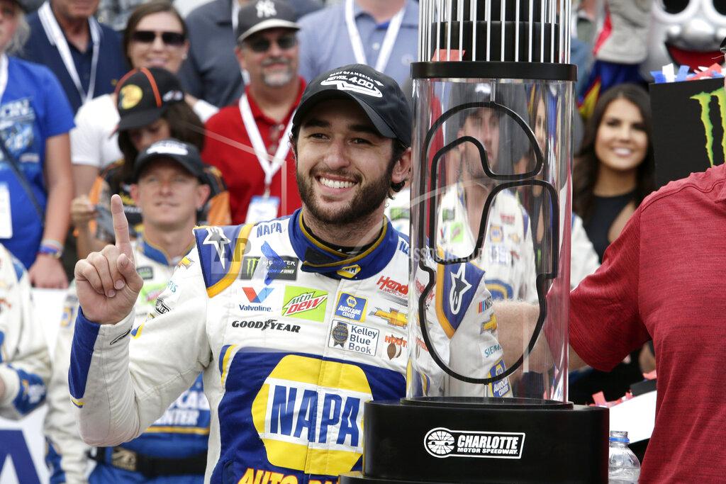 Wesley Broome Chase Elliott poses with the trophy after winning the NASCAR Cup Series auto race at Charlotte Motor Speedway in Concord, N.C., Sunday, Sept. 29, 2019. (AP Photo/Wesley Broome)