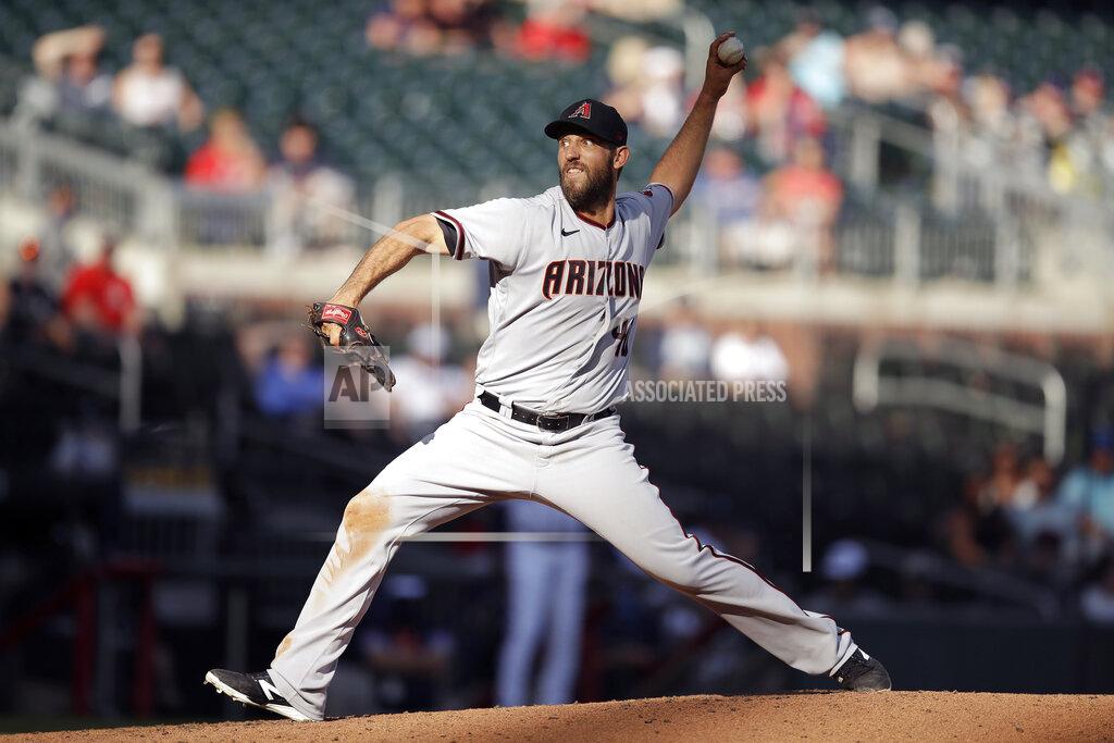 Ben Margot Arizona Diamondbacks pitcher Madison Bumgarner works against the Atlanta Braves in the seventh inning of the second baseball game of a double header Sunday, April 25, 2021, in Atlanta. (AP Photo/Ben Margot)