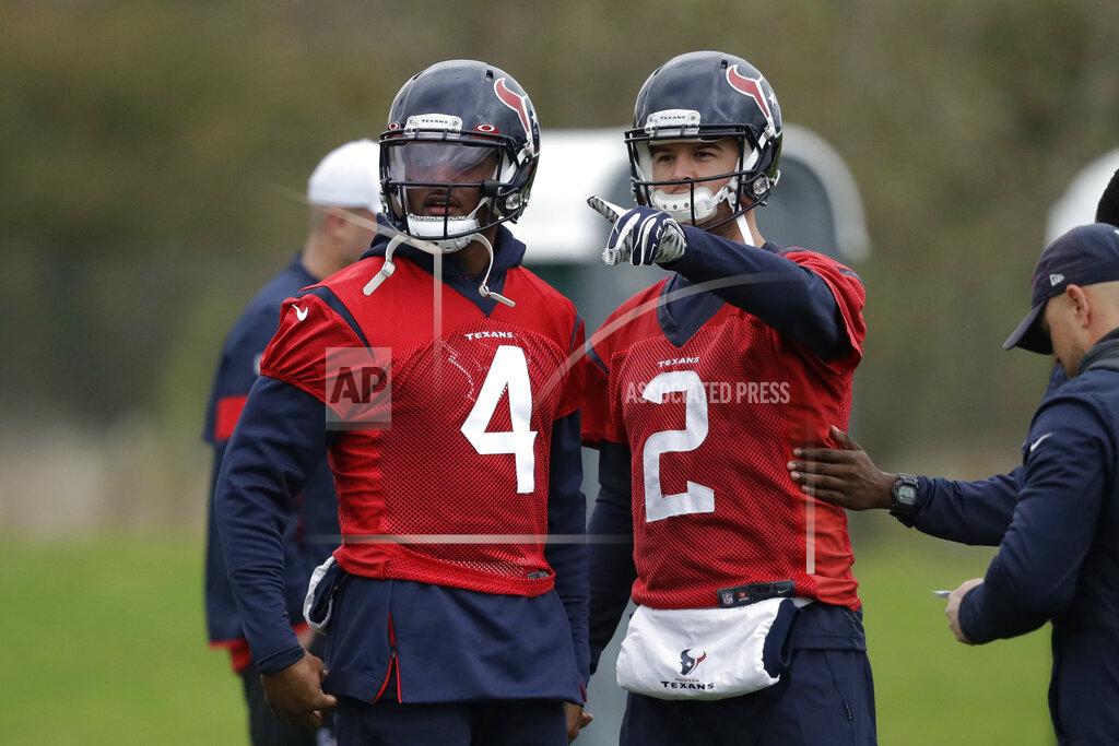 Matt Dunham Houston Texans' quarterback Deshaun Watson, 4, talks with quarterback AJ McCarron, 2, during an NFL practice session at the London Irish rugby team training ground in the Sunbury-on-Thames suburb of south west London, Friday, Nov. 1, 2019. The Houston Texans are preparing for an NFL regular season game against the Jacksonville Jaguars in London on Sunday. (AP Photo/Matt Dunham)