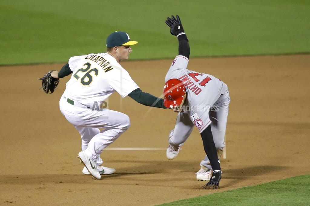 Oakland Athletics third baseman Matt Chapman (26) tags out Los Angeles Angels' Shohei Ohtani during the tenth inning of a baseball game in Oakland, Calif., Friday, July 24, 2020. (AP Photo/Jeff Chiu)