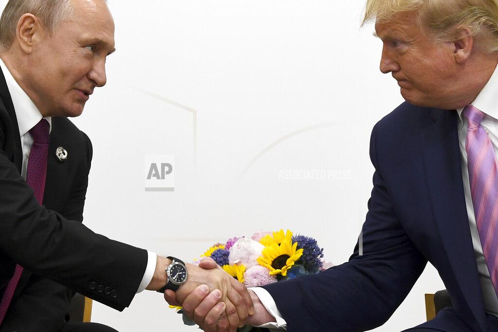 Susan Walsh FILE - In this file photo taken on Friday, June 28, 2019, President Donald Trump, right, shakes hands with Russian President Vladimir Putin during a bilateral meeting on the sidelines of the G-20 summit in Osaka, Japan. From Moscow, the U.S. election looks like a contest between "who dislikes Russia most," according to Kremlin spokesman Dmitry Peskov. Russian President Vladimir Putin is frustrated with President Donald Trump's failure to deliver on his promise to fix ties between the countries. But Democratic challenger Joe Biden does not offer the Kremlin much hope either. (AP Photo/Susan Walsh, File)